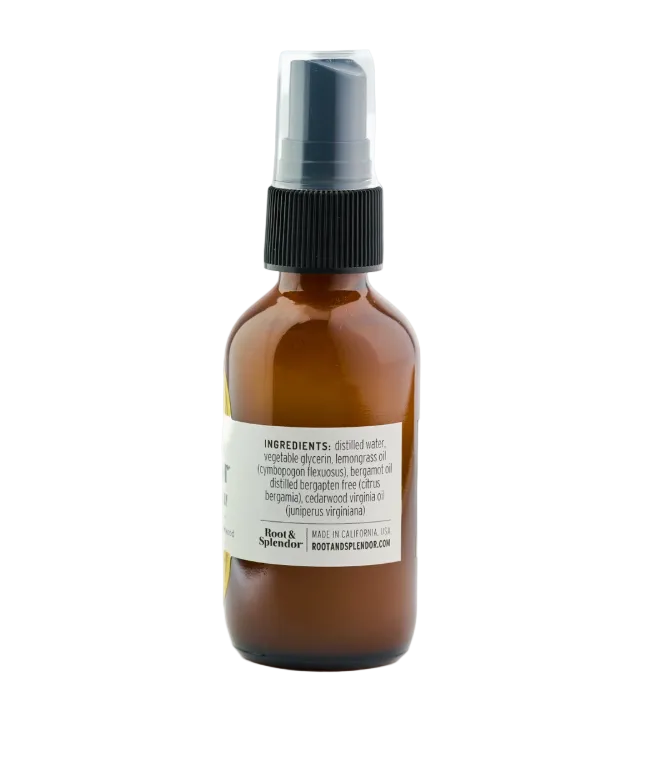 Brown spray bottle with a label on a white background
